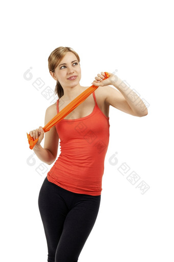 年轻的健身女人火车与丝带美丽的年轻的健身女人火车与橙色丝带白色背景