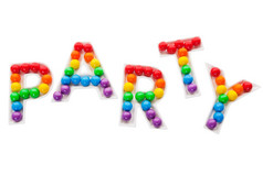聚会，派对信托盘填满与彩虹色彩斑斓的泡沫口香糖拍摄白色背景