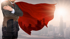 双曝光商人超级英雄与天际线概念成功领导和胜利业务混合媒体商人超级英雄
