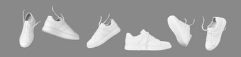 飞行白色皮革运动鞋孤立的灰色的背景时尚时尚的体育休闲鞋子有创意的简约布局与鞋子广告为鞋商店博客