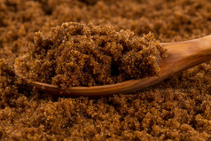 棕色（的）muscovado糖木勺子的糖背景