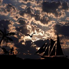 古董帆船航行壮观的日落热带海景背景插图