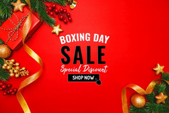 拳击一天出售与圣诞节现在和圣诞节装饰红色的背景