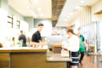 模糊咖啡馆背景模糊咖啡师服务客户计数器咖啡咖啡馆背景食物和喝业务概念