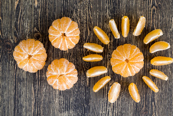 去皮普通话木董事会一个普通话划分成片橘子柑橘类折叠的形状的太阳橘子太阳模式