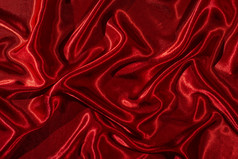 背景红色的缎织物闪亮的丝绸背景