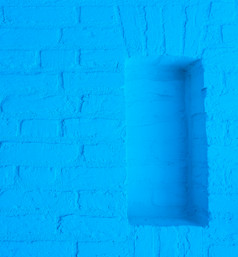 现代霓虹灯蓝色的彩色的砖墙纹理背景与空框架开放