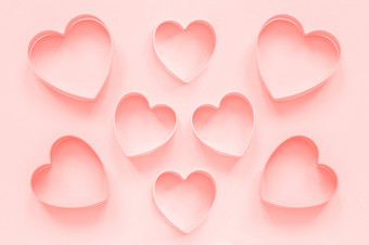粉红色的<strong>刀具</strong>饼干心形状柔和的粉红色的背景colar健美的爱浪漫的模式模板粉红色的<strong>刀具</strong>饼干心形状柔和的粉红色的背景colar健美的爱浪漫的模式模板