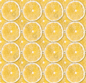 新鲜的黄色的<strong>柠檬片</strong>无缝的模式关闭柑橘类水果背景工作室摄影背景新鲜的黄色的<strong>柠檬片</strong>无缝的模式关闭工作室摄影