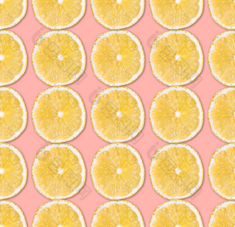 新鲜的黄色的<strong>柠檬片</strong>无缝的模式关闭柑橘类水果片柔和的粉红色的背景工作室摄影背景新鲜的黄色的<strong>柠檬片</strong>无缝的模式关闭工作室摄影