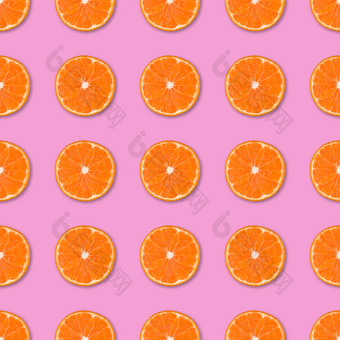 新鲜的橙色橘子片无缝的模式关闭柑橘类水果粉红色的背景<strong>工作室摄影</strong>新鲜的橙色橘子片无缝的模式关闭柑橘类水果背景<strong>工作室摄影</strong>