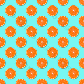 新鲜的橙色橘子片无缝的模式关闭柑橘类水果蓝色的背景<strong>工作室摄影</strong>新鲜的橙色橘子片无缝的模式关闭柑橘类水果背景<strong>工作室摄影</strong>