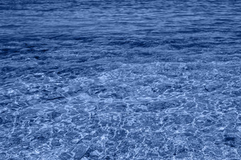 海水背景<strong>涟漪</strong>蓝色的透明的水海与太阳反射横幅与颜色的一年海水背景<strong>涟漪</strong>蓝色的透明的水海与太阳反射