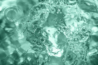 池热浴缸极可意水流按摩浴缸水背景涟漪健美的绿松石透明的水游泳池与光反射前视图池热浴缸极可意水流按摩浴缸水背景涟漪健美的绿松石透明的水游泳池与光反射前视图
