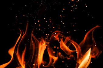 火行火焰与火花孤立的黑色的背景决议火燃烧的壁炉火行火焰与火花孤立的黑色的背景决议火燃烧的壁炉