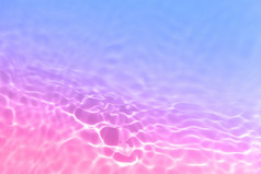 血清水纹理关闭明亮的蓝色的和粉红色的梯度液体过来这里背景透明的美护肤品样本水清晰的透明的背景横幅与复制空间血清水纹理关闭明亮的蓝色的和粉红色的梯度液体过来这里背景透明的美护肤品样本水清晰的透明的背景横