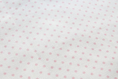 背景和纹理光灰色的棉花织物与尘土飞扬的粉红色的波尔卡点