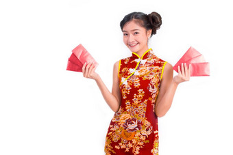 年轻的亚洲美女人穿<strong>旗袍</strong>和携带红色的包钱中国人新一年节日事件孤立的白色背景假期和生活方式概念<strong>旗袍</strong>衣服穿