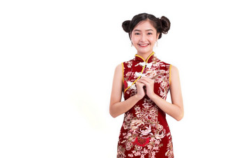 年轻的亚洲美女人穿旗袍和祝福问候手势中国人新一年节日事件孤立的白色背景假期和生活方式概念旗袍衣服穿