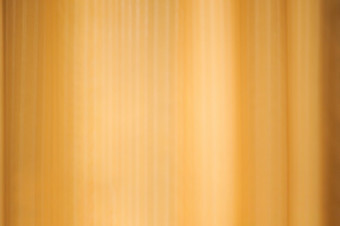 的影子的透明的窗帘黄金墙模糊窗帘背景纹理设计