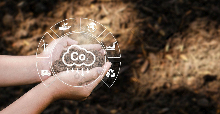 的概念排放的手种植土壤为的环境碳二氧化物排放全球气候变暖可持续发展的发展和环境业务从可再生能源
