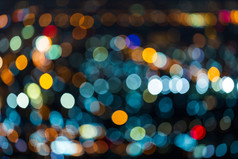 色彩斑斓的光摘要圆形散景的城市晚上背景