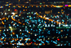 色彩斑斓的光摘要圆形散景的城市晚上背景