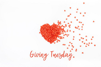 给周二全球一天慈善给后黑色的星期五购物一天慈善机构给帮助捐款和支持概念与文本消息和红色的心形状的五彩纸屑白色背景
