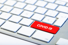 冠状病毒概念键盘与红色的关键和新冠病毒消息