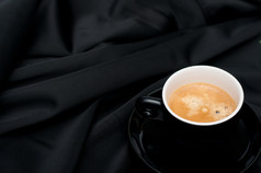 杯表示咖啡黑色的柔滑的布料