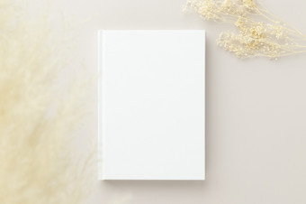 白色书空白封面模型米色背景平躺模型