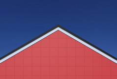 呈现红色的广场模式山墙外观墙与黑色的屋顶蓝色的天空背景