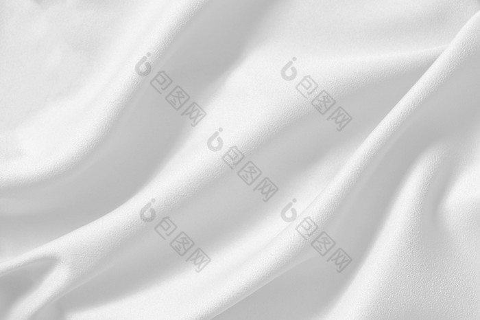 白色棉花织物纹理背景无缝的模式自然纺织与软焦点白色光滑的弯曲的丝绸纹理纹理背景为复制背景