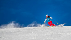 女人女孩女滑雪滑雪下坡在阳光明媚的一天