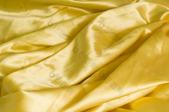 背景布黄色的丝绸织物纹理背景模式摘要背景奢侈品织物液体波波浪纹理难看的东西丝绸纹理缎天鹅绒材料壁纸设计