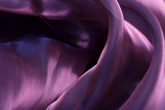 紫罗兰色的丝绸褶皱背景纹理紫罗兰色的丝绸褶皱背景
