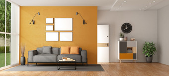 生活房间现代别墅与灰色的沙发对橙色墙和前面通过背景呈现生活房间现代别墅