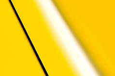 明亮的黄色的闪闪发光的车辆面板背景