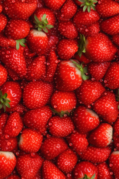 清洗水果水滴背景摄影图特写摄影红色草莓
