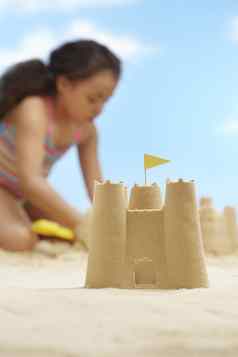 女孩年建筑沙子城堡海滩焦点沙子城堡前景