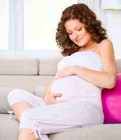 美丽的怀孕了女人期待婴儿孕妇概念