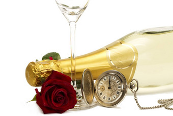 湿红色的玫瑰香槟瓶口袋里看空香槟玻璃