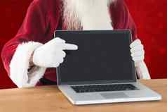 复合图像快乐圣诞老人显示移动PC屏幕