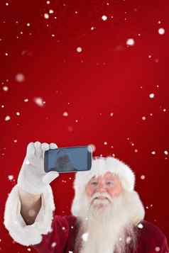 复合图像圣诞老人采取自拍电话