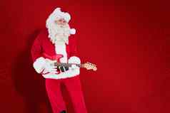 复合图像快乐圣诞老人玩电吉他