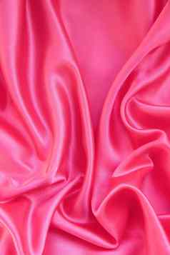 光滑的优雅的粉红色的丝绸缎背景