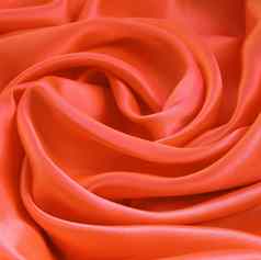 光滑的优雅的橙色丝绸缎背景