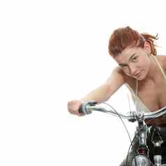 有吸引力的红色头发的人女人自行车