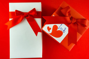 情人节礼物盒子红色的弓红色的背景图像