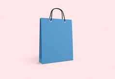 蓝色的纸袋购物粉红色的背景